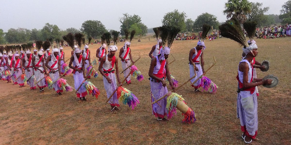 People of the Munda community playing 'Huot Bhuang' in a fertility festival